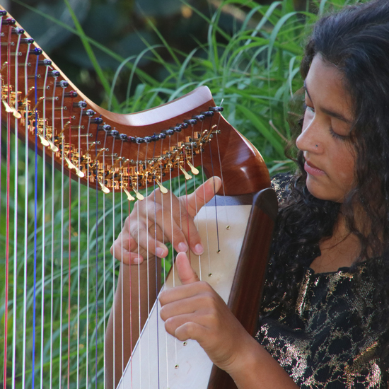 Our harper listening to the tone of the harp.